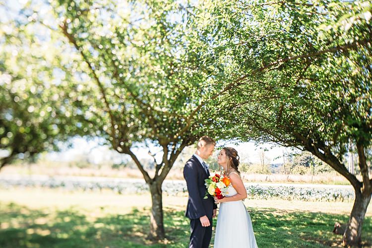 Bride Lace Tulle Bridal Gown Grey Sash Bright Orange Red Yellow Bouquet Groom Navy Blue Suit Trees Organic Farm Wedding Washington http://www.katiedayphotos.com/