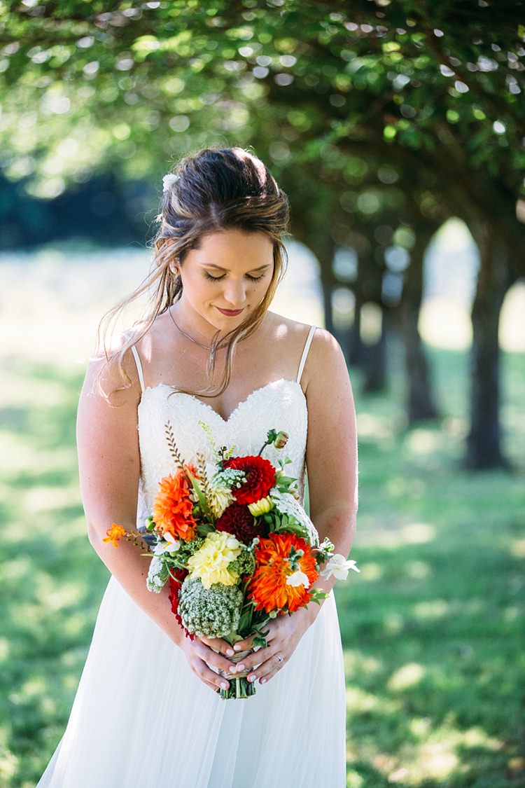 Bride Lace Tulle Bridal Gown Grey Sash Bright Bouquet Red Orange Yellow Florals Soft Hairstyle Organic Farm Wedding Washington http://www.katiedayphotos.com/