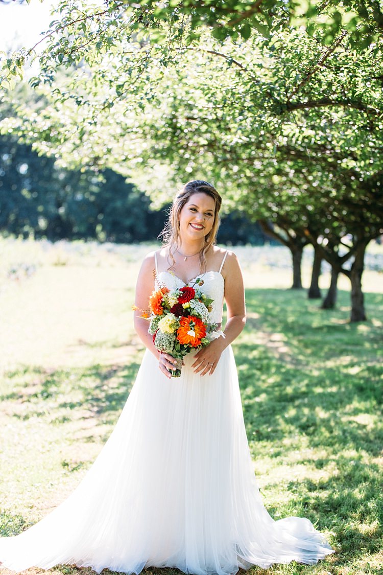 Bride Lace Tulle Bridal Gown Grey Sash Bright Orange Red Yellow Bouquet Loose Curls Hairstyle Trees Organic Farm Wedding Washington http://www.katiedayphotos.com/