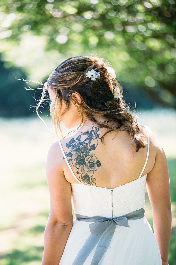 Bride Lace Tulle Bridal Gown Grey Sash Loose Curls Hairstyle White Flowers Back Tattoo Trees Organic Farm Wedding Washington http://www.katiedayphotos.com/