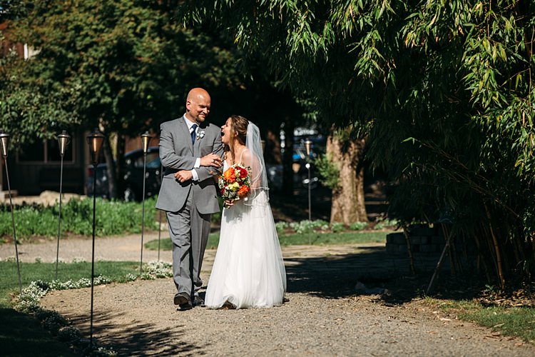 Outdoor Ceremony Bride Lace Tulle Bridal Gown Grey Sash Veil Bright Orange Red Yellow Bouquet Father Laughs Organic Farm Wedding Washington http://www.katiedayphotos.com/