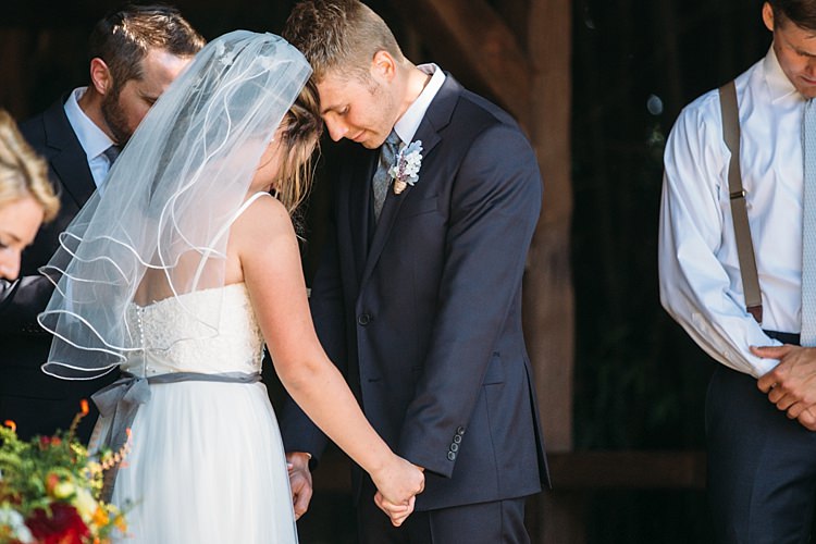 Outdoor Ceremony Bride Lace Tulle Bridal Gown Grey Sash Veil Groom Navy Blue Suit Grey Tie Floral Button Hole Organic Farm Wedding Washington http://www.katiedayphotos.com/