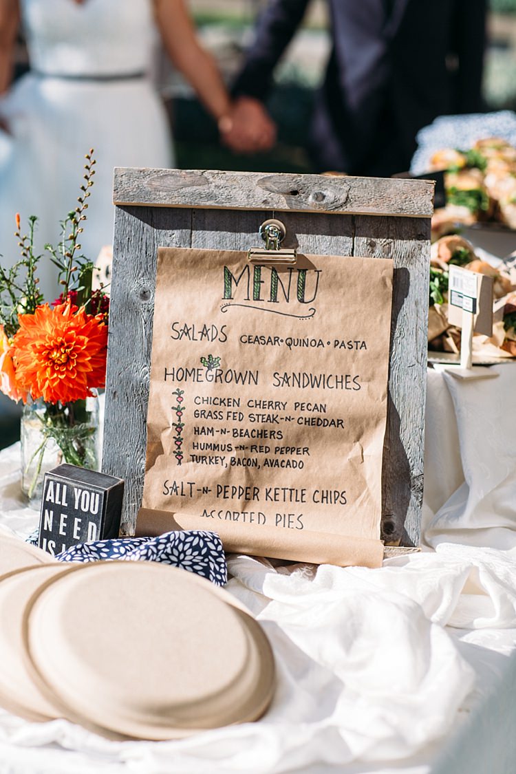 Outdoor Reception Food Menu Handwritten Wooden Stand Fresh Bright Orange Red Florals Sandwiches Organic Farm Wedding Washington http://www.katiedayphotos.com/