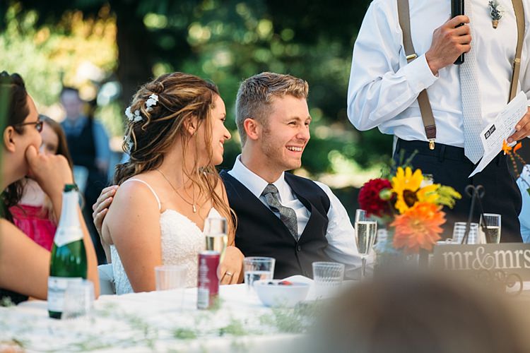 Outdoor Reception Speeches Bride Lace Tulle Bridal gown Loose Curls Hairstyle Flowers Groom Navy Blue Vest Grey Tie Organic Farm Wedding Washington http://www.katiedayphotos.com/