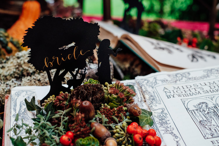 Place Name Book Moss Acorns Berries Cut Out Whimsical Midsummer Night's Dream Wedding Ideas http://www.annapumerphotography.com/