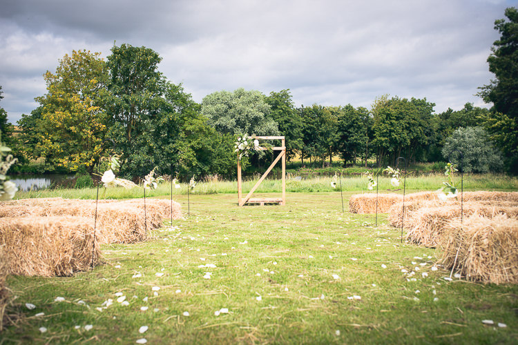 Ceremony Hay Bales Decor Backdrop Flowers Outdoor Boho Botanical Farm Wedding http://www.lauraophotography.com/
