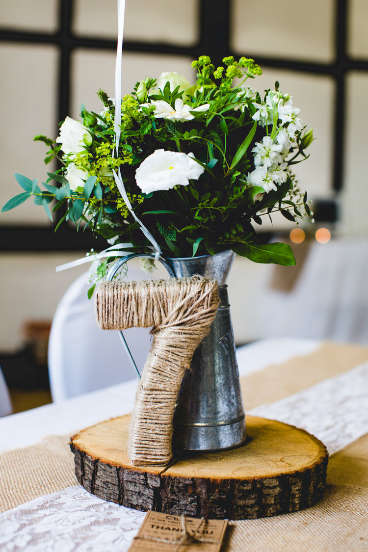 White Jug Flowers Log Slice Twine Table Number Decor Stylish Relaxed Fun White Wedding http://www.livvy-hukins.co.uk/
