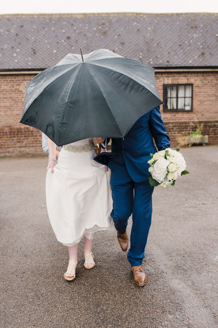 Rainy Umbrella Simple Elegant Pretty Barn Wedding http://www.fayecornhillphotography.co.uk/