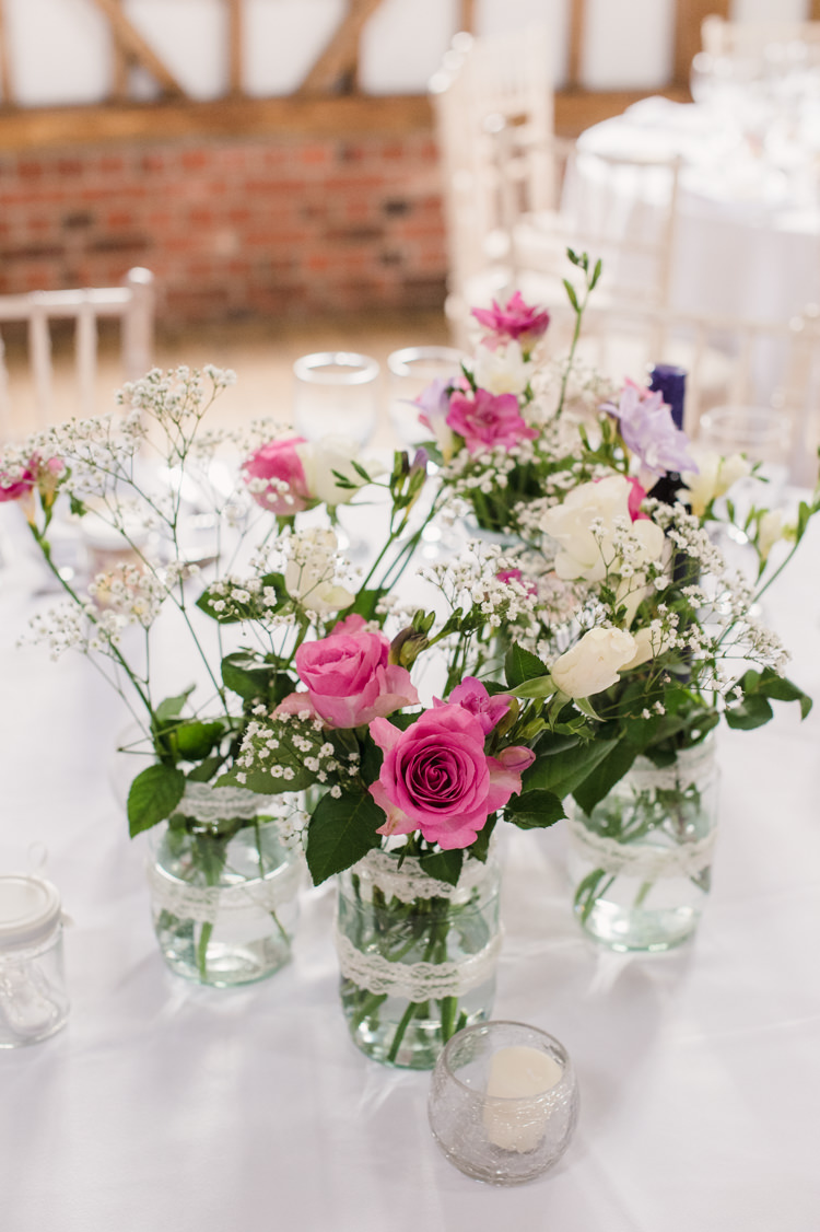 Flowers Jars Lace Centrepiece Decor Simple Elegant Pretty Barn Wedding http://www.fayecornhillphotography.co.uk/