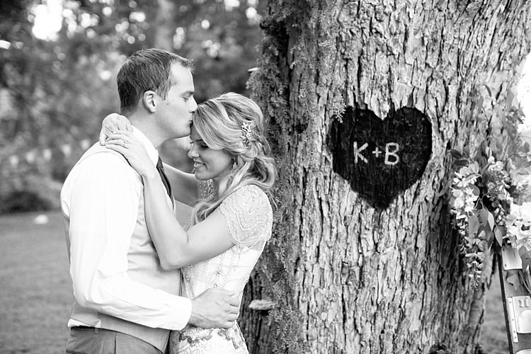 Bride Beaded Jenny Packham Bridal Gown Gold Hair Comb Groom Khaki Pants Vest Brown Tie Tree Carved Heart Initials Fresh Florals Gold & Peach Riverside Garden Wedding http://kellyhornberger.com/ 