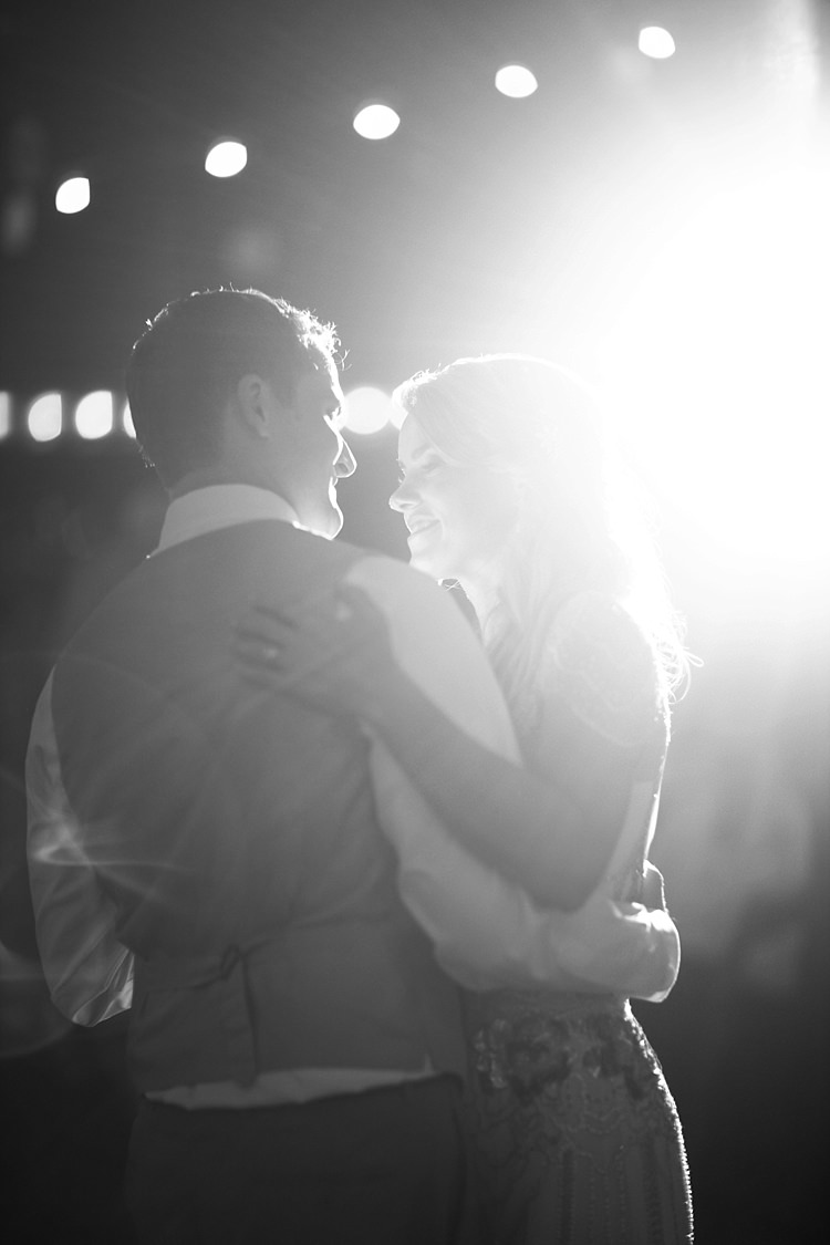 Bride Beaded Jenny Packham Bridal Gown Groom Khaki Pants Vest Dance Hanging Fairy Lights Gold & Peach Riverside Garden Wedding http://kellyhornberger.com/ 