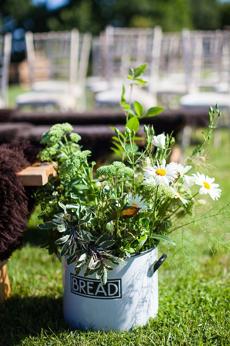 Bread Tin Flowers Aisle Decor Foliage WIld Pretty Outdoorsy Yellow Tipi Wedding http://www.binkynixon.com/