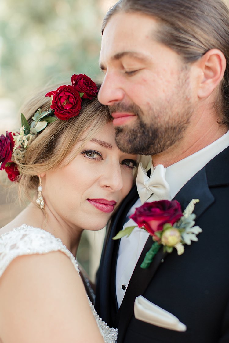 First Look Bride Lace V Neck Bridal Gown Red Maroon Rose Floral Crown Groom Black Suit White Shirt Bowtie Rose Buttonhole Luxe Outdoor Garden Wedding in California http://figlewiczphotography.com/