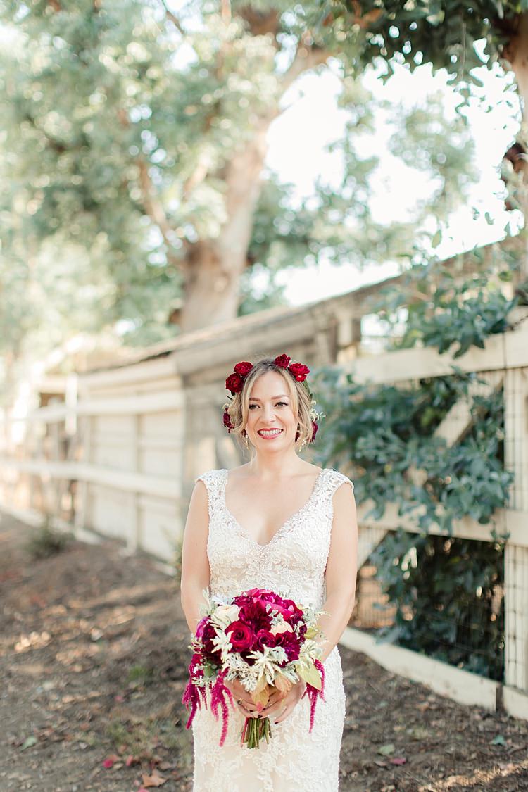 Bride Lace V Neck Bridal Gown Red Maroon Rose Floral Crown Bouquet Red Pink Cream Rose Garden Rose Amaranth Trees Luxe Outdoor Garden Wedding in California http://figlewiczphotography.com/