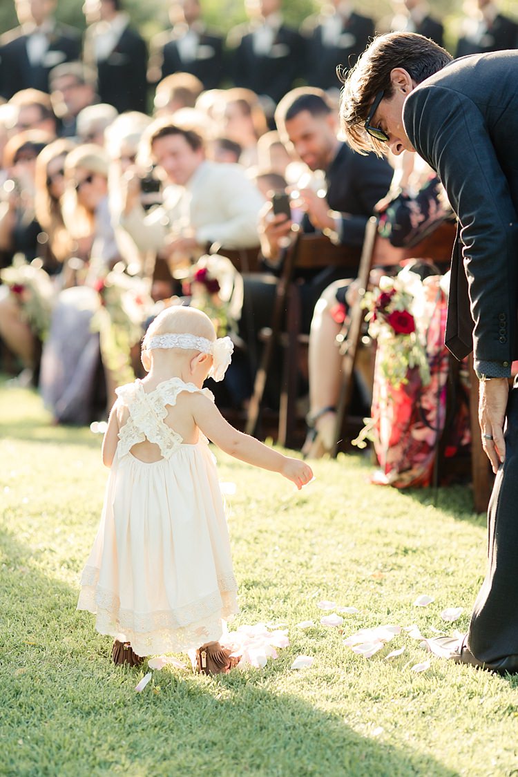 Outdoor Ceremony Flowergirl White Lace Dress Flower Headband Petals Guests Wooden Chairs Fresh Florals Luxe Outdoor Garden Wedding in California http://figlewiczphotography.com/