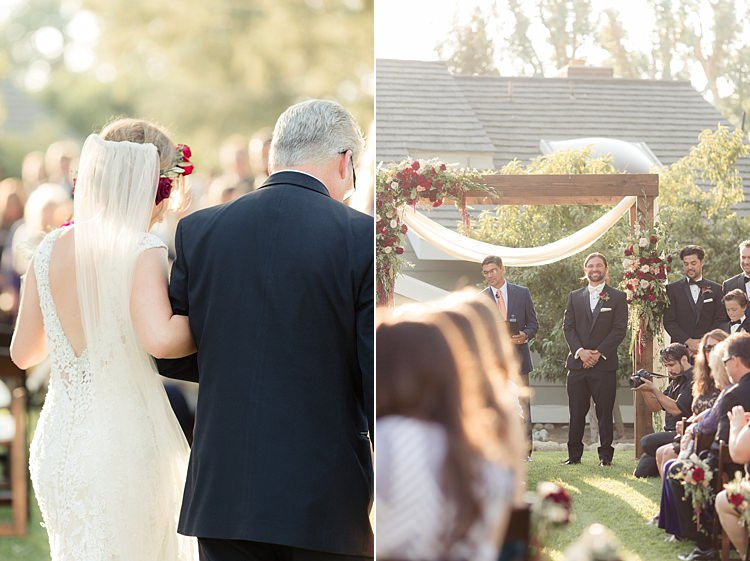 Outdoor Ceremony Bride Entrance Father Groom Decorated Wooden Arch Red Maroon Cream Roses Amaranth Guests Luxe Outdoor Garden Wedding in California http://figlewiczphotography.com/