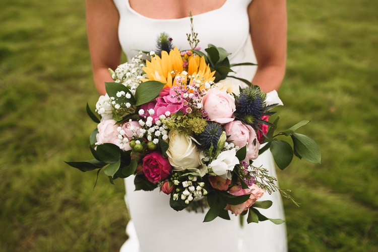 Bouquet Flowers Bride Bridal Sunflower Peony Gypsophila Colourful Outdoorsy Festival Tipi Wedding http://www.jacksonandcophotography.com/