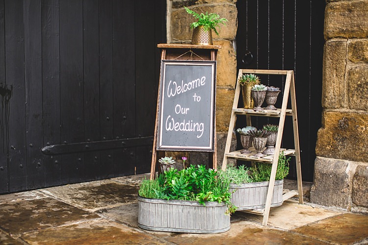Welcome Sign Black Board Ladder Decor Eclectic Foliage Edison Lights Wedding http://www.tobiahtayo.com/