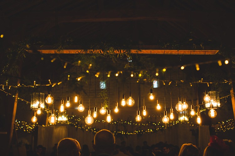Eclectic Foliage Edison Lights Lighting Barn Wedding http://www.tobiahtayo.com/