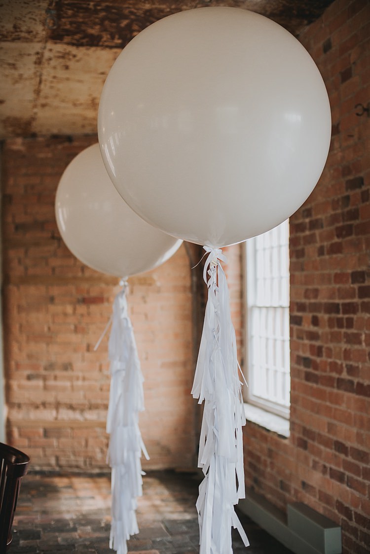 Giant White Balloons Tassel Industrial Cool Mill Greenery Wedding http://www.beckyryanphotography.co.uk/