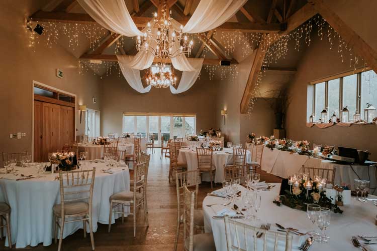 Hyde Barn Fairy Lights Drapes Rose Gold Autumn Barn Wedding http://www.weddingphotographyincheltenham.co.uk/