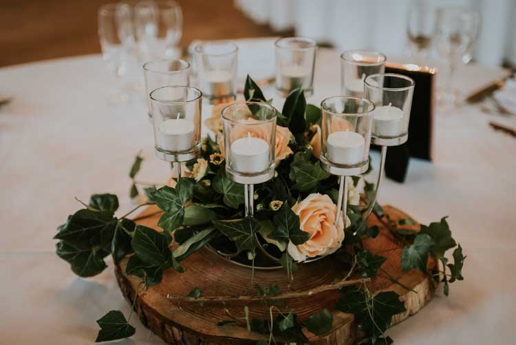Candles Flowers Log Centrepiece Decor Rose Gold Autumn Barn Wedding http://www.weddingphotographyincheltenham.co.uk/