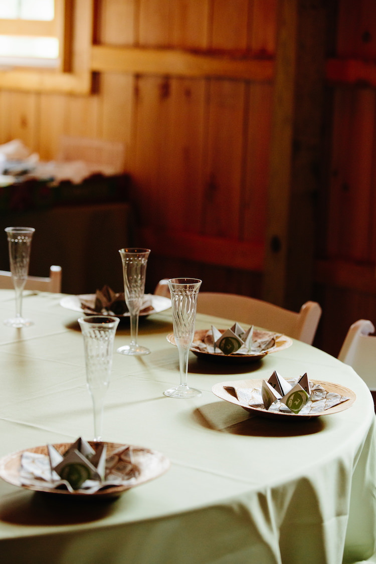 Table Setting Champagne Flutes Origami Green Table Cloth Barn Reception Art Nouveau Autumn Burgundy Wedding http://www.jbonadiophoto.com/