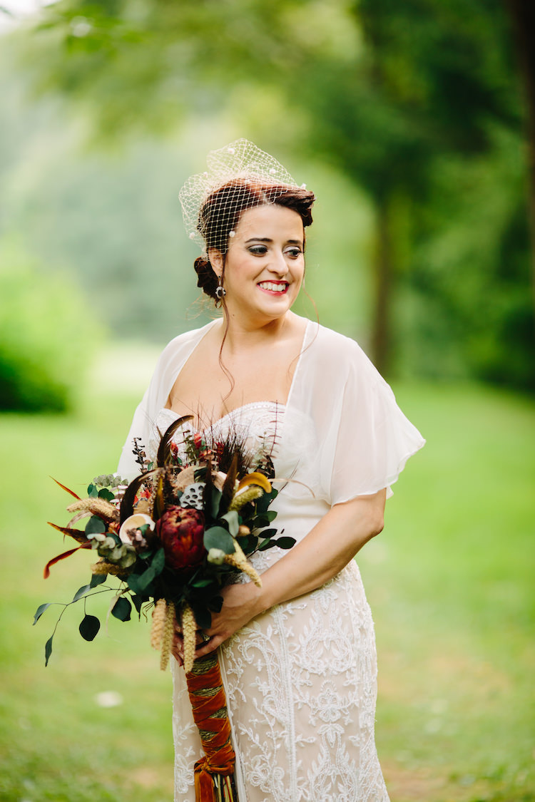 Bride Strapless Lace Watters Bridal Gown Sheer Top Birdcage Veil Art Deco Earrings Bouquet Dried Flowers Feathers Antique Orange Velvet Ribbon Art Nouveau Autumn Burgundy Wedding http://www.jbonadiophoto.com/