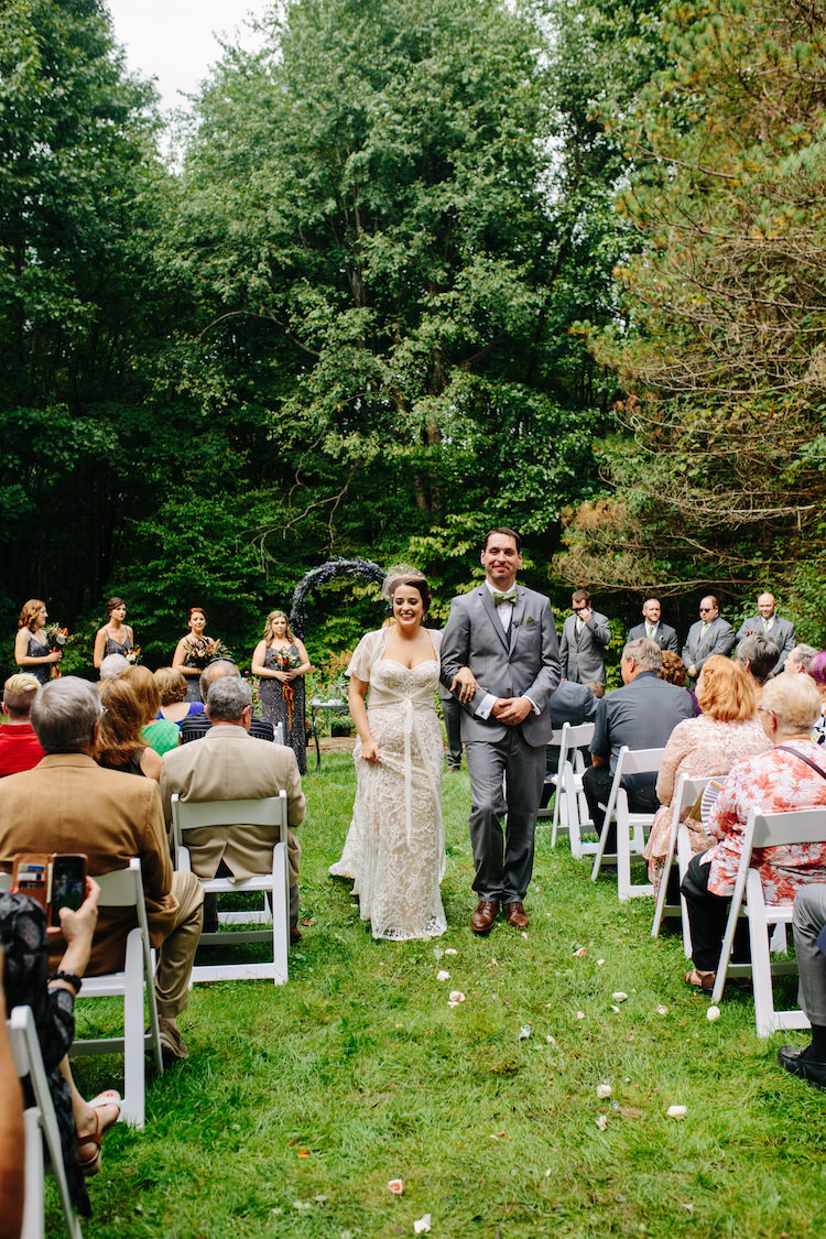 Outdoor Ceremony Floral Archway Bride Strapless Lace Watters Bridal Gown Sheer Top Birdcage Veil Groom Grey Suit Green Bowtie Bridesmaids Groomsmen Guests Art Nouveau Autumn Burgundy Wedding http://www.jbonadiophoto.com/