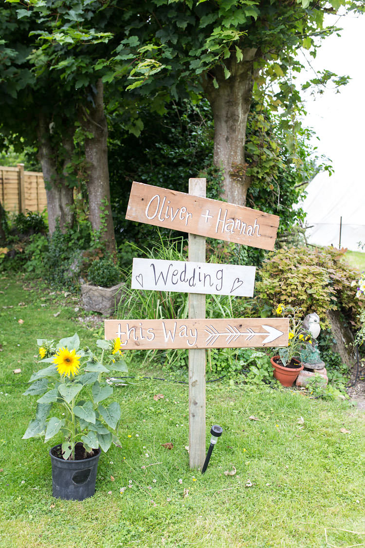 Wooden Sign Post Painted Summer Sunflowers Marquee Wedding http://maddiewaters.co.uk/