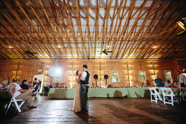 Barn Reception Fairy Lights Bride Groom First Dance Guests White Chairs Hanging Décor Art Nouveau Autumn Burgundy Wedding http://www.jbonadiophoto.com/