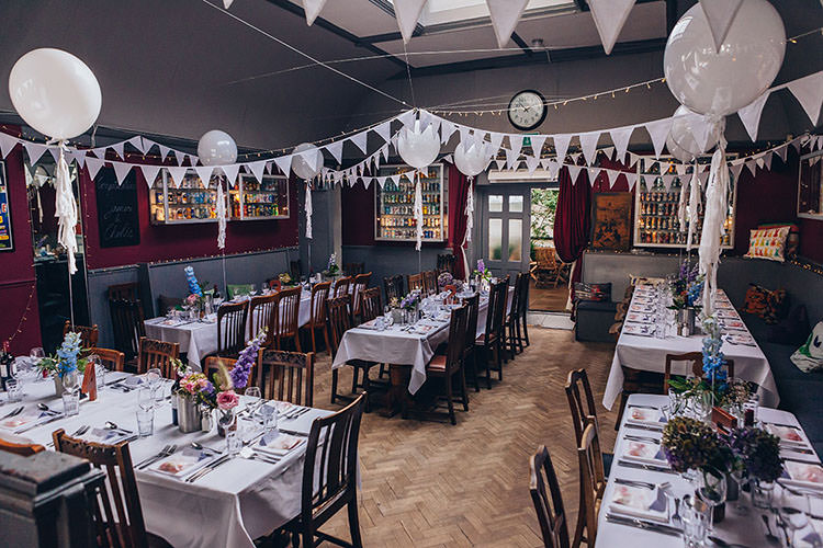 White Balloons Bunting Parquet Floor Fairy Lights Minimalist City 1970s East London Pub Wedding http://www.curiousrosephotography.com/