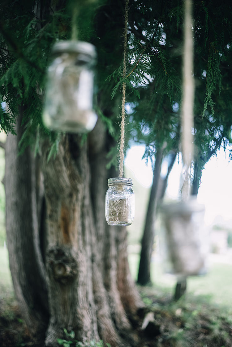 Outdoor Ceremony Hanging Décor Mason Jars Delicate Plants Tall Leafy Tree Woodland Waterfall Mint Wedding Ontario http://www.laurenmccormickphotography.com/