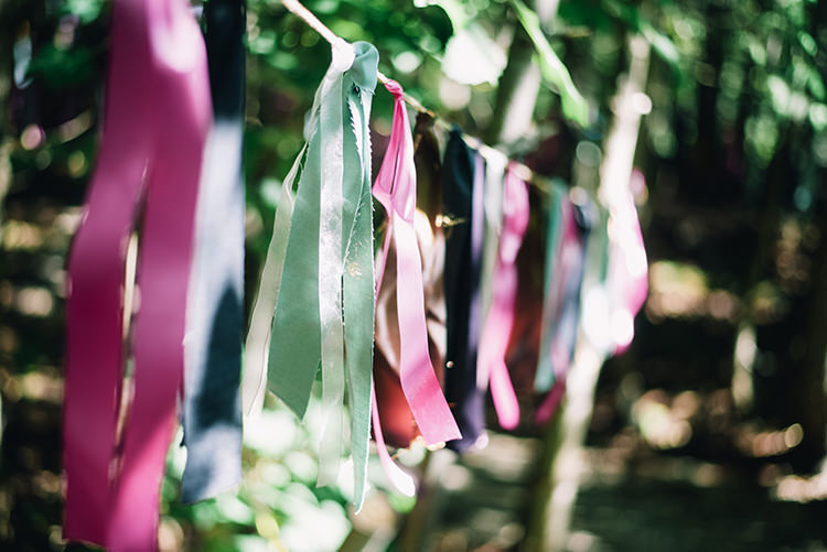 Outdoor Ceremony Hanging Décor Multicoloured Ribbon Bunches Trees Woodland Waterfall Mint Wedding Ontario http://www.laurenmccormickphotography.com/