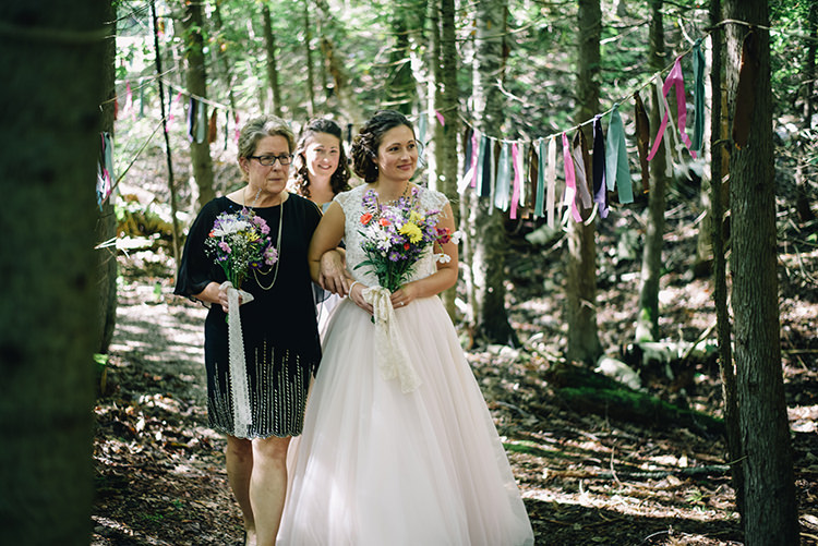 Outdoor Ceremony Bride Allure Champagne Lace Tulle Bridal Gown Multicoloured Floral Bouquet Mother Entrance Hanging Décor Coloured Ribbons Trees Woodland Waterfall Mint Wedding Ontario http://www.laurenmccormickphotography.com/