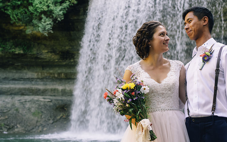Bride Allure Champagne Lace Tulle Bridal Gown Multicoloured Floral Bouquet Lace Ribbon Groom White Shirt Brown Leather Suspenders Navy Pants Multicoloured Floral Buttonhole Woodland Waterfall Mint Wedding Ontario http://www.laurenmccormickphotography.com/