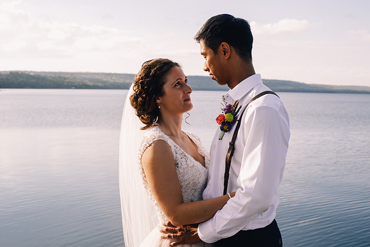 Bride Allure Champagne Lace Tulle Bridal Gown Long Veil Pearl Earrings Groom White Shirt Brown Leather Suspenders Navy Pants Multicoloured Floral Buttonhole Woodland Waterfall Mint Wedding Ontario http://www.laurenmccormickphotography.com/