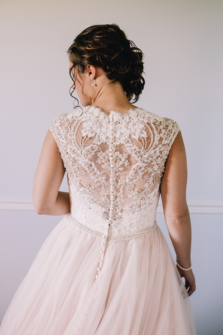 Bride Allure Champagne Lace Tulle Bridal Gown Buttons Pearl Earrings Soft Curls Hairstyle Woodland Waterfall Mint Wedding Ontario http://www.laurenmccormickphotography.com/
