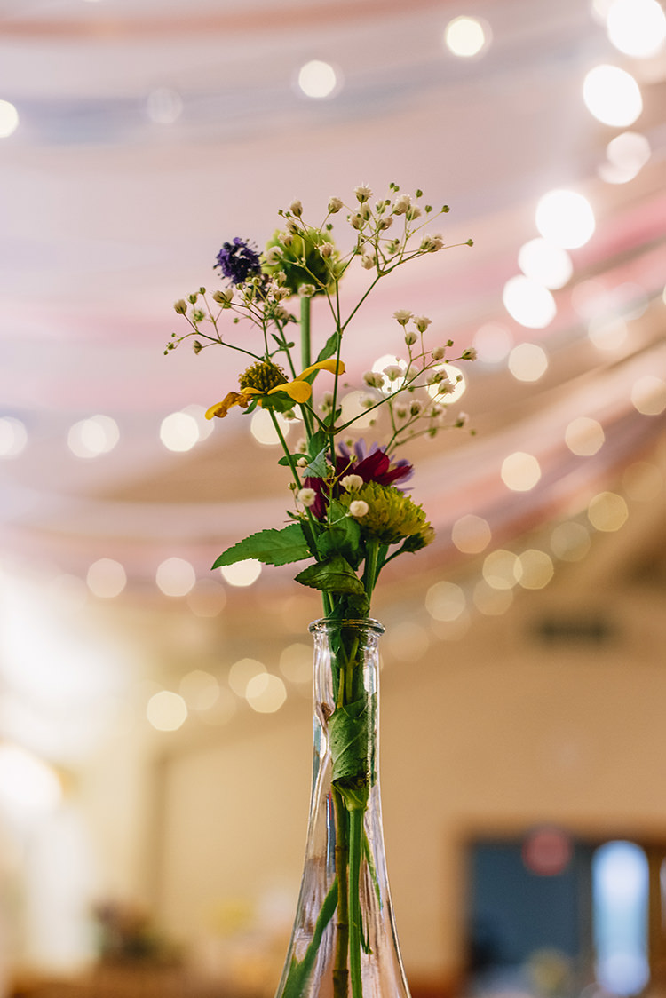 Reception Multicoloured Florals Yellow Purple Pink Daises Gypsophila Tall Glass Vase Fairy Lights Woodland Waterfall Mint Wedding Ontario http://www.laurenmccormickphotography.com/