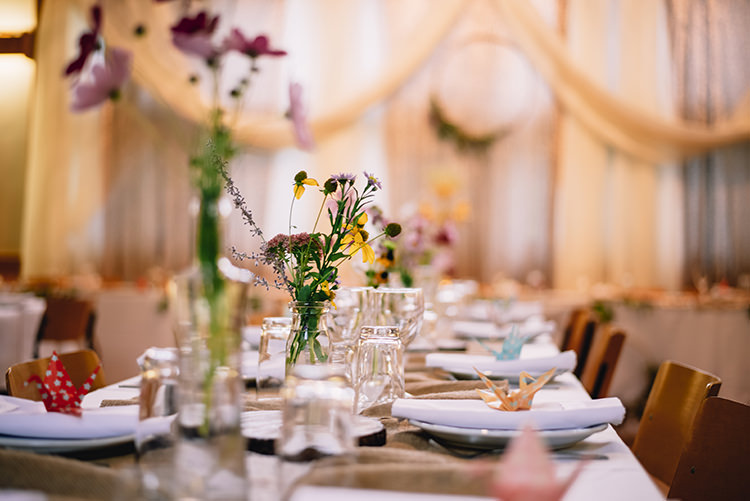Reception Long Table Fresh Multicoloured Florals Daises Gypsophila Tall Glass Vases Origami Crane Hanging Wreath Woodland Waterfall Mint Wedding Ontario http://www.laurenmccormickphotography.com/