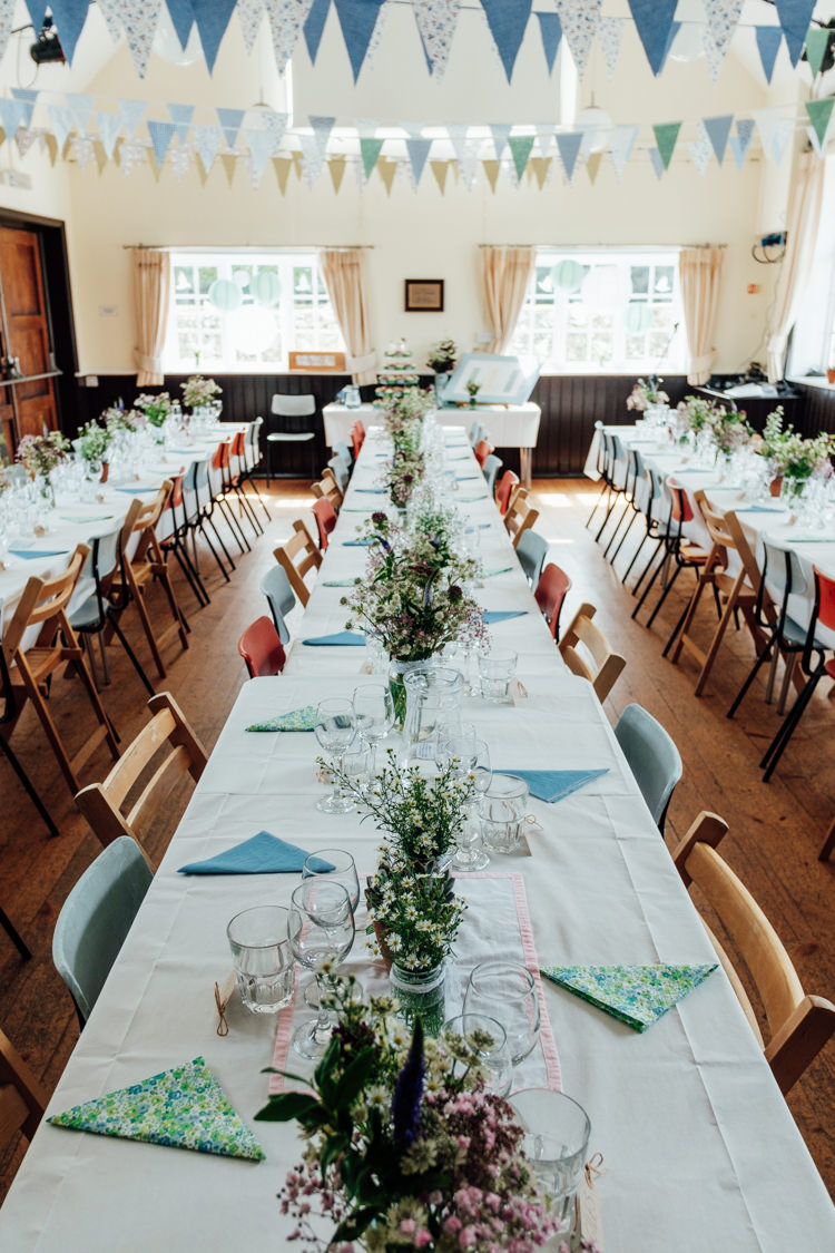 Blue White Bunting Flowers Tables Long Chairs Rural Handfasting Village Hall Wedding http://www.annapumerphotography.com/