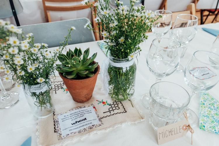 Jars Flowers Succulents Daisies Rural Handfasting Village Hall Wedding http://www.annapumerphotography.com/