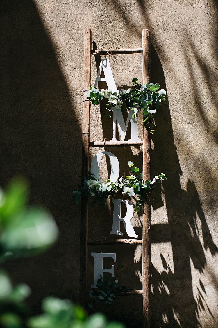 Ceremony Décor Wooden Ladder White Florals Greenery Large Letters Amore Rustic Chic Greenery Wedding Ideas in Tuscany http://www.tastino0.it/