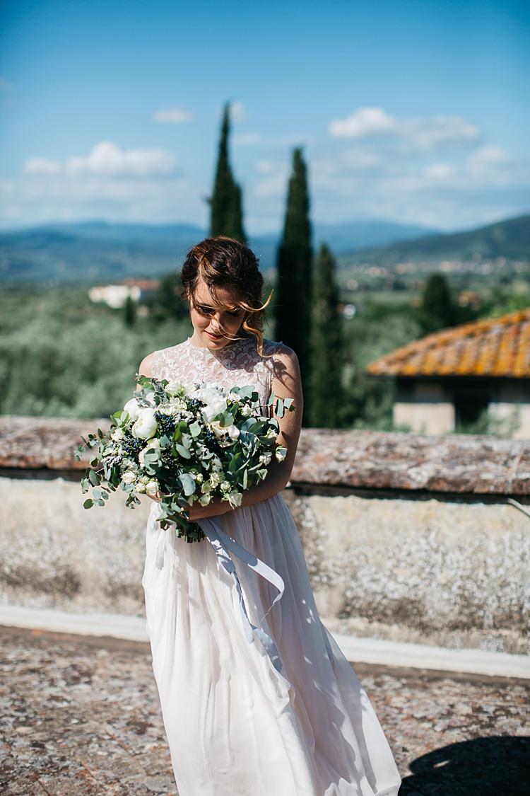 Bride High Neck Lace Tulle Bridal Gown Bouquet White Florals Greenery Long Ribbon Beautiful Views Rustic Chic Greenery Wedding Ideas in Tuscany http://www.tastino0.it/