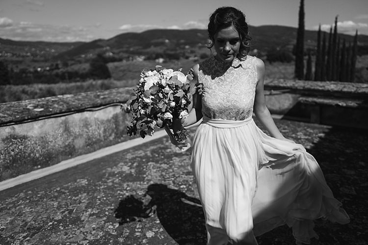 Bride High Neck Lace Tulle Bridal Gown Bouquet White Roses Greenery Loose Curls Hairstyle Rustic Chic Greenery Wedding Ideas in Tuscany http://www.tastino0.it/