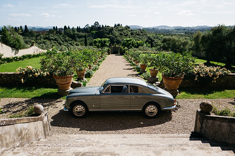 Outdoor Staircase Vintage Grey Car Large Potted Plants Green Lawn Trees Rustic Chic Greenery Wedding Ideas in Tuscany http://www.tastino0.it/