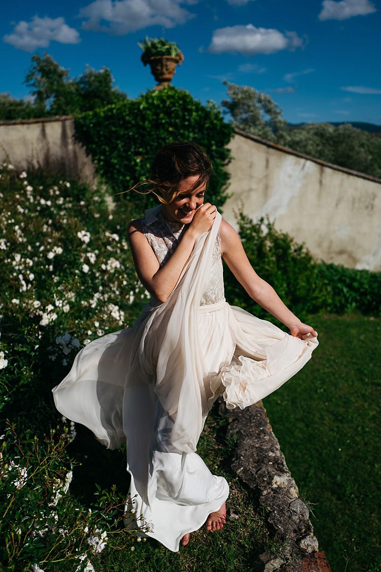 Bride High Neck Lace Tulle Bridal Gown Soft Curls Hairstyle White Flowers Green Lawn Rustic Chic Greenery Wedding Ideas in Tuscany http://www.tastino0.it/