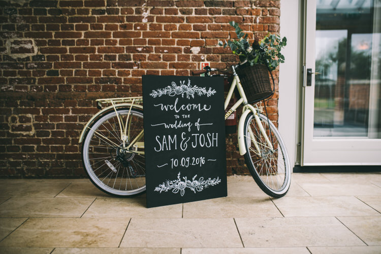 Bicycle Bike Flowers Decor Welcome Sign Black Chalk Board Magical Bohemian Barn Wedding http://www.jamespowellphotography.co.uk/