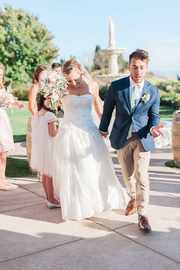 Outdoor Ceremony Bride Lace Sweetheart Strapless Bridal Gown Veil Bouquet Groom Navy Jacket Beige Pants Light Green Tie Bridesmaids Water Fountain Soft Blush Sage Green Wedding California http://julia-rosephotography.com/