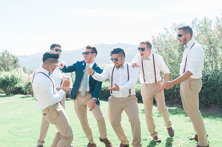 Groom Navy Jacket Beige Pants Light Green Tie Sunglasses Groomsmen White Shirt Green Bowtie Leather Suspenders Beige Pants Brown Leather Shoes Soft Blush Sage Green Wedding California http://julia-rosephotography.com/